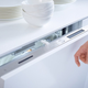 Illustration for article titled A Simple Knock Opens This Dishwasher, Keeping the Front Panel Clean